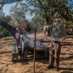 ranger cooking lunch while on safari
